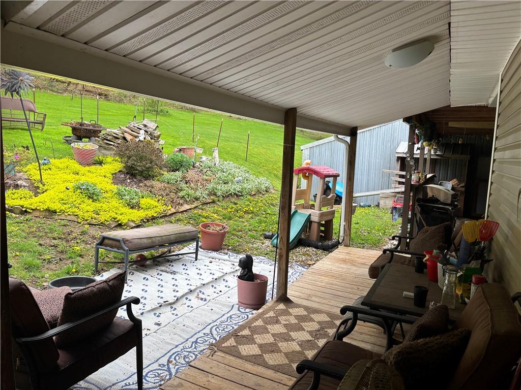 13008 Highway 286 Commodore, PA 15729 - Photo 19 of 23 a view of a patio with table and chairs and potted plants