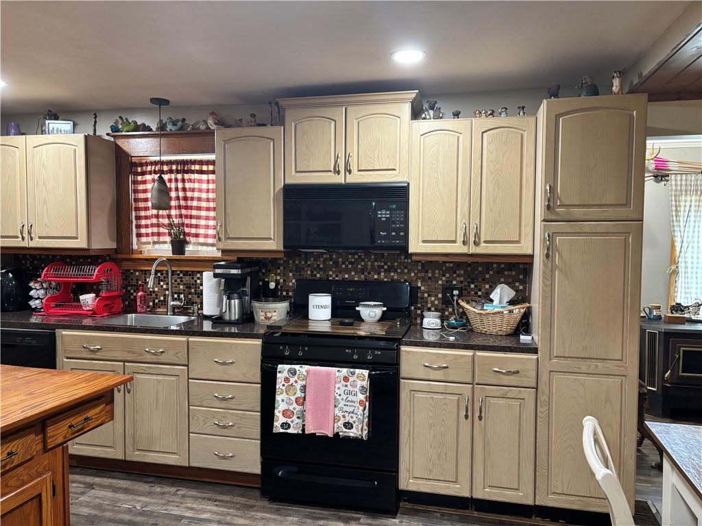13008 Highway 286 Commodore, PA 15729 - Photo 6 of 23 a kitchen with granite countertop a refrigerator stove top oven and sink
