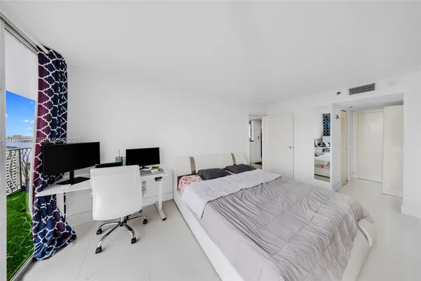 a bedroom with a workspace