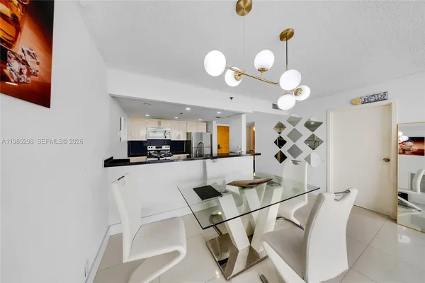 a kitchen with a table and chairs