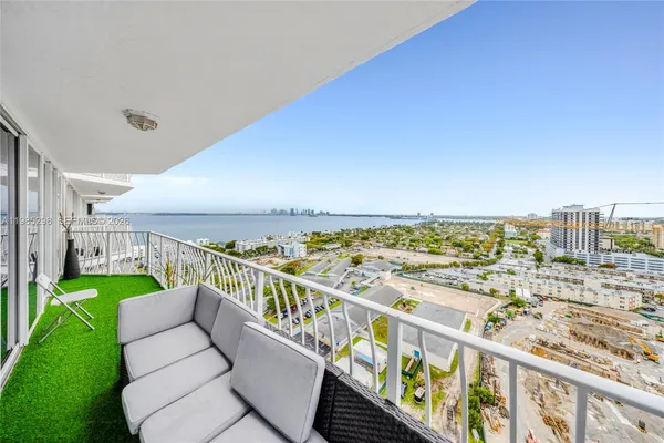 a view of a balcony with an ocean view