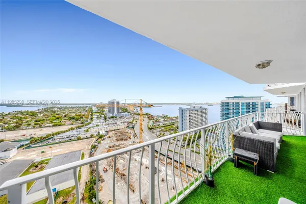 a view of a balcony with chairs