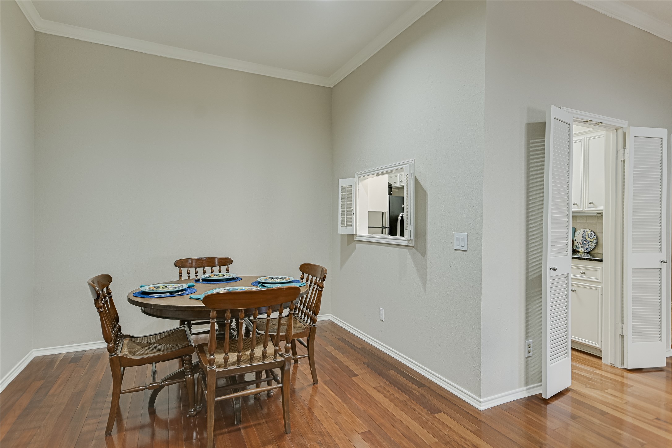 1502 West 5th Street, Unit H2 Austin, TX 78703 - Photo 4 of 17 a view of a dining room with furniture and wooden floor
