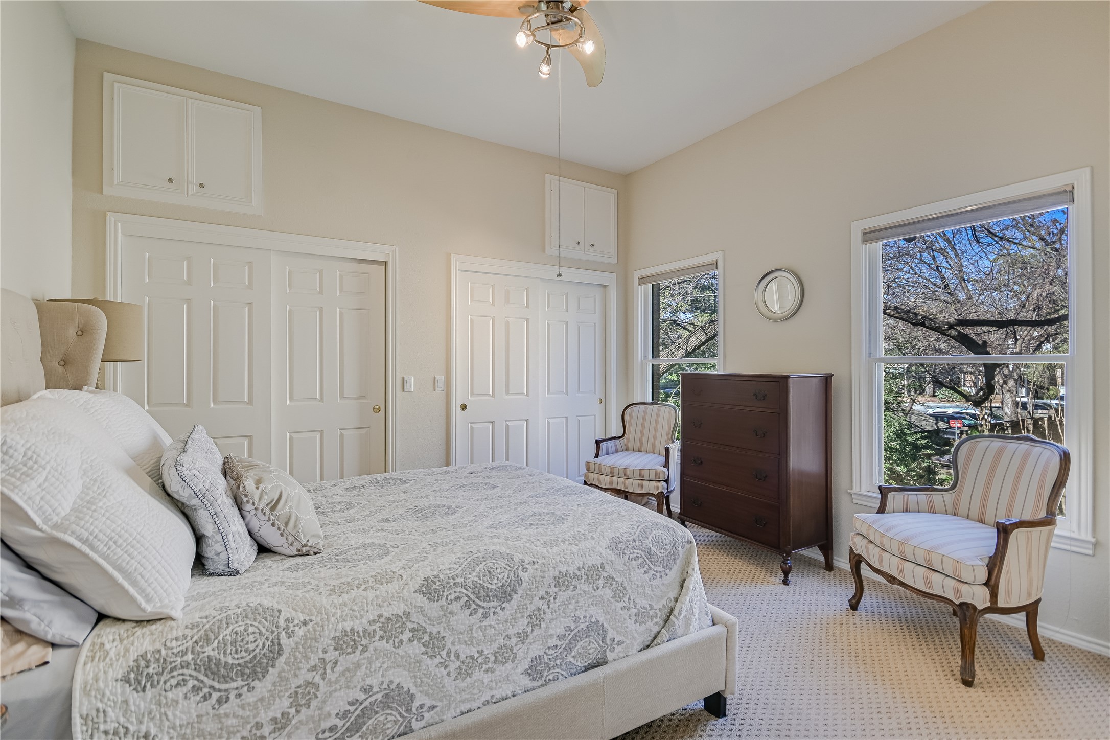 1502 West 5th Street, Unit H2 Austin, TX 78703 - Photo 7 of 17 a bedroom with a bed and a chair