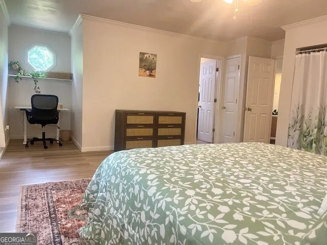 a bedroom with a bed and a chair