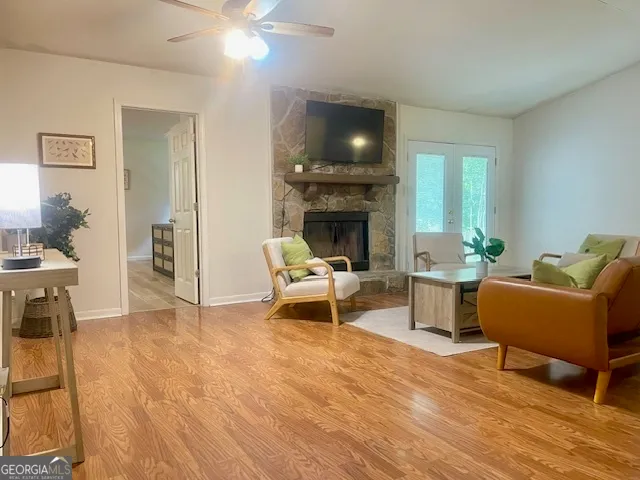 a living room with furniture and a fireplace