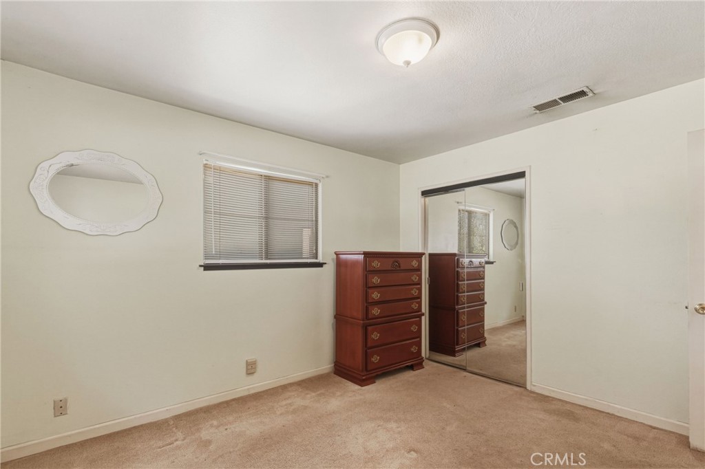 6812 Helton Street Winton, CA 95388 - Photo 17 of 24 an empty room with windows and cabinet