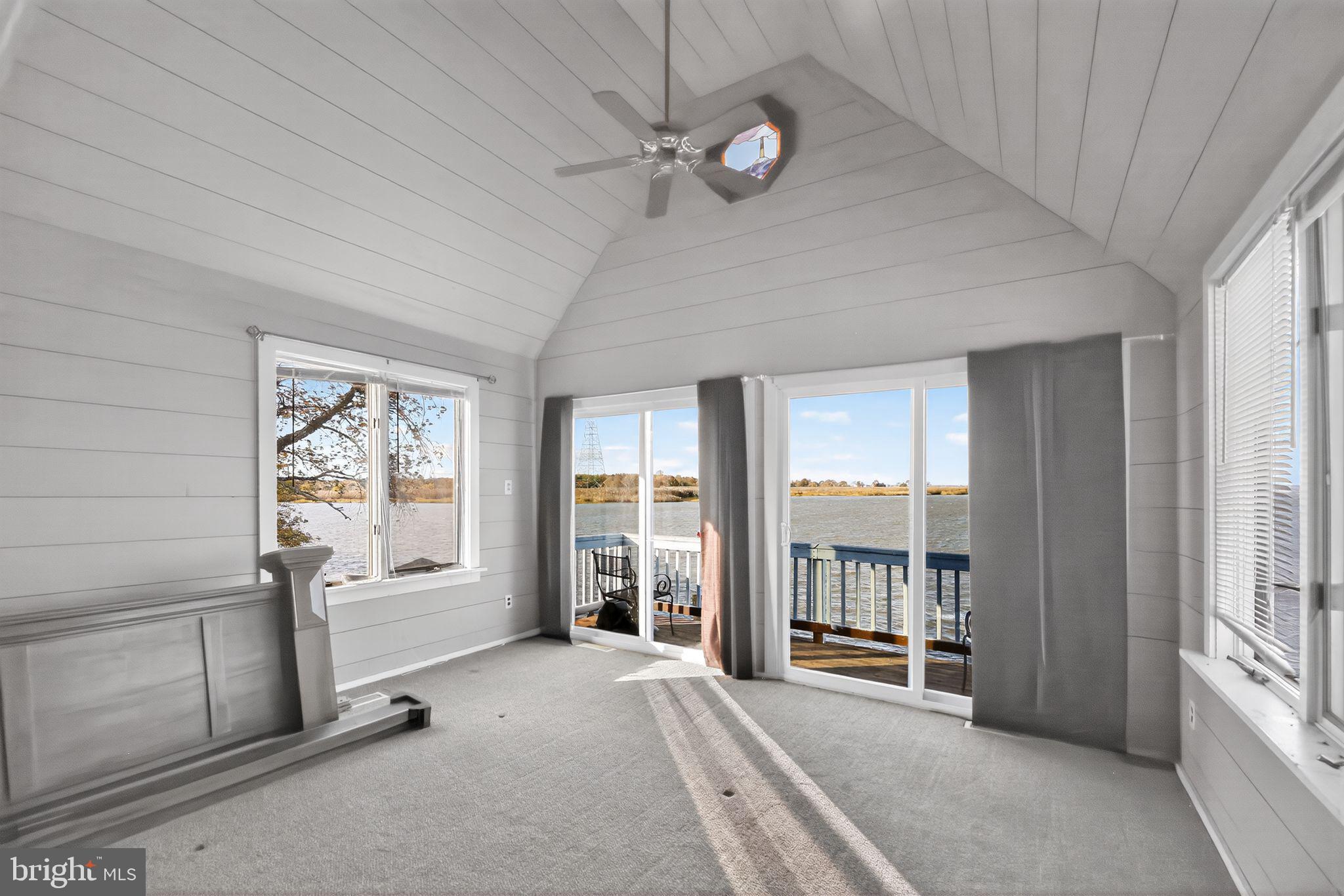 92 Sinnickson Landing Road Salem, NJ 08079 - Photo 16 of 39 a view of a livingroom with a chandelier fan and windows