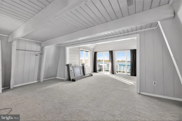 a view of entryway with wooden walls