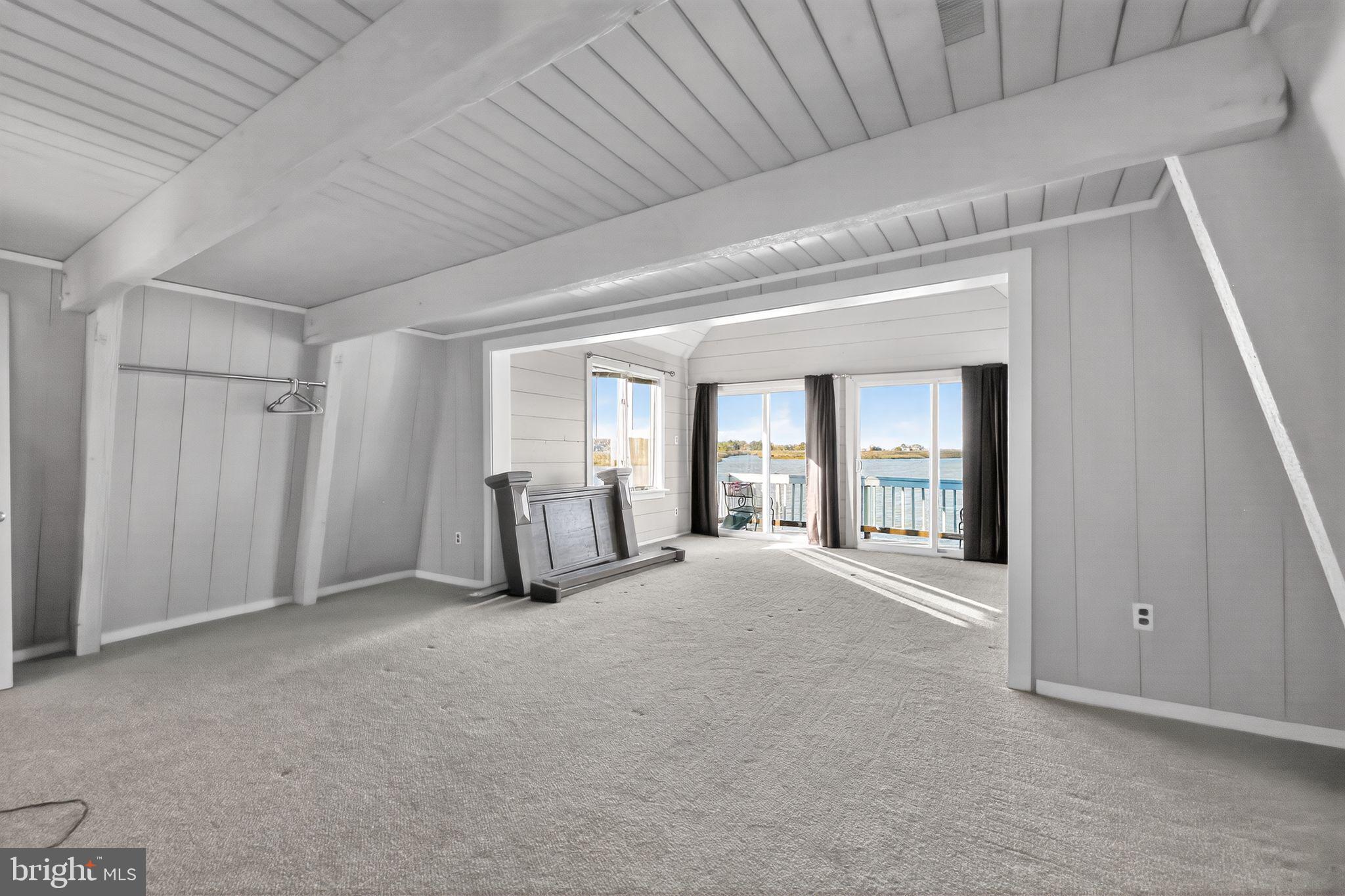 92 Sinnickson Landing Road Salem, NJ 08079 - Photo 18 of 39 a view of an empty room with window and cabinet