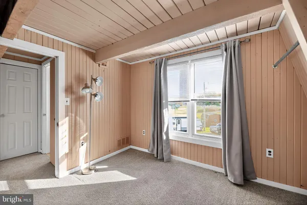 a view of an empty room and stairs