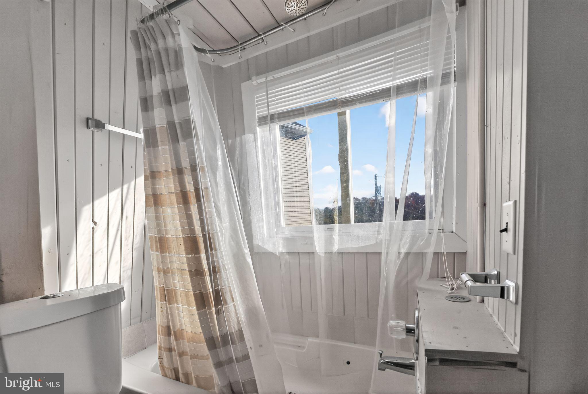 92 Sinnickson Landing Road Salem, NJ 08079 - Photo 22 of 39 a view of a bathroom with a sink and mirror with window