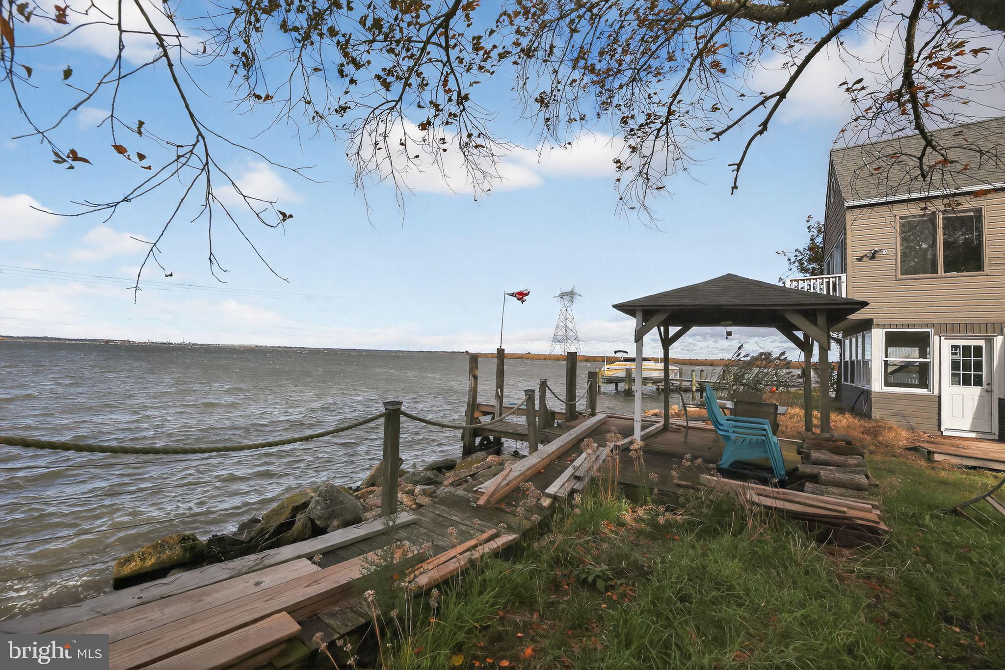 92 Sinnickson Landing Road Salem, NJ 08079 - Photo 30 of 39 a roof deck with table and chairs
