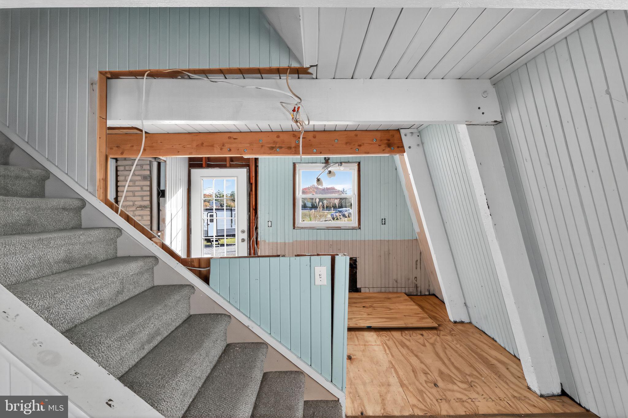92 Sinnickson Landing Road Salem, NJ 08079 - Photo 10 of 36 a view of a hallway with wooden floor and staircase