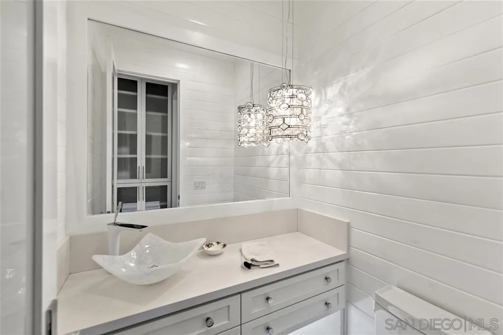 139 27th Street Del Mar, CA 92014 - Photo 14 of 25 a bathroom with a sink and a mirror