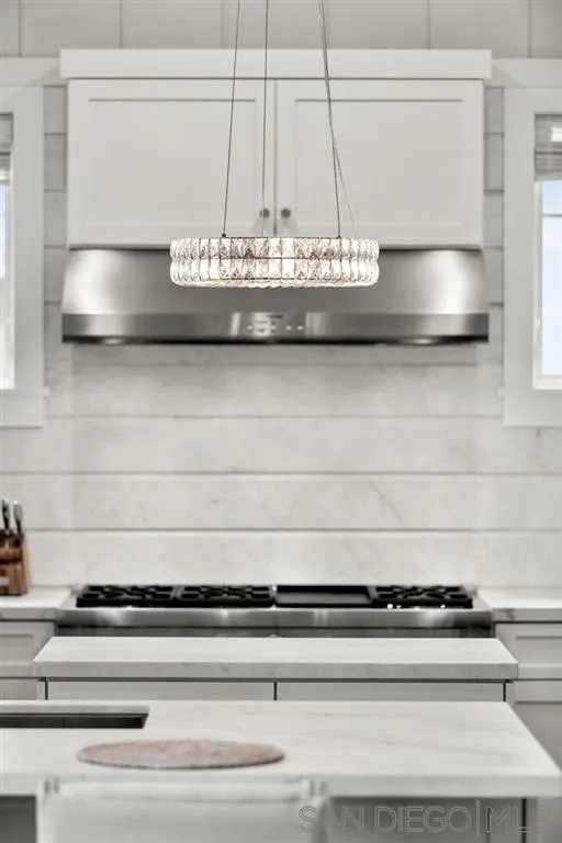 139 27th Street Del Mar, CA 92014 - Photo 20 of 25 a close view of kitchen countertops with granite countertop cabinets