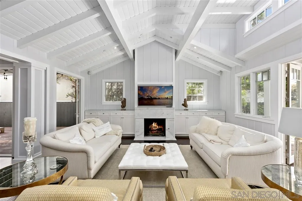 139 27th Street Del Mar, CA 92014 - Photo 2 of 25 a living room with furniture a flat screen tv and a fireplace