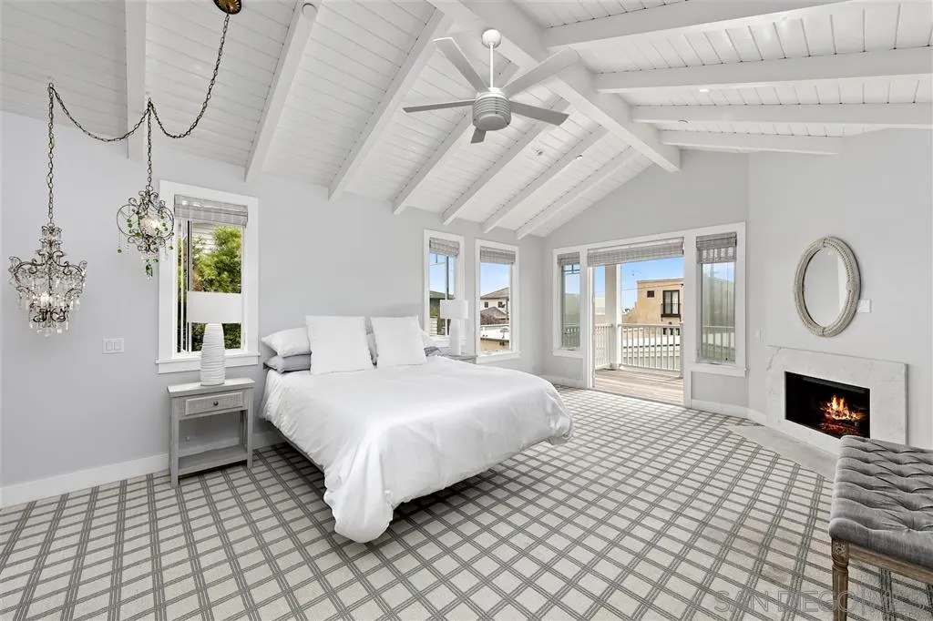 139 27th Street Del Mar, CA 92014 - Photo 9 of 25 a spacious bedroom with a bed mirror and window