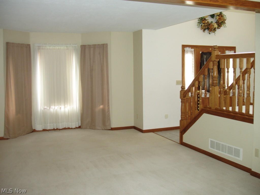 13132 Whitney Road Strongsville, OH 44136 - Photo 4 of 21 Living Room features a bow window & freshly cleaned carpet