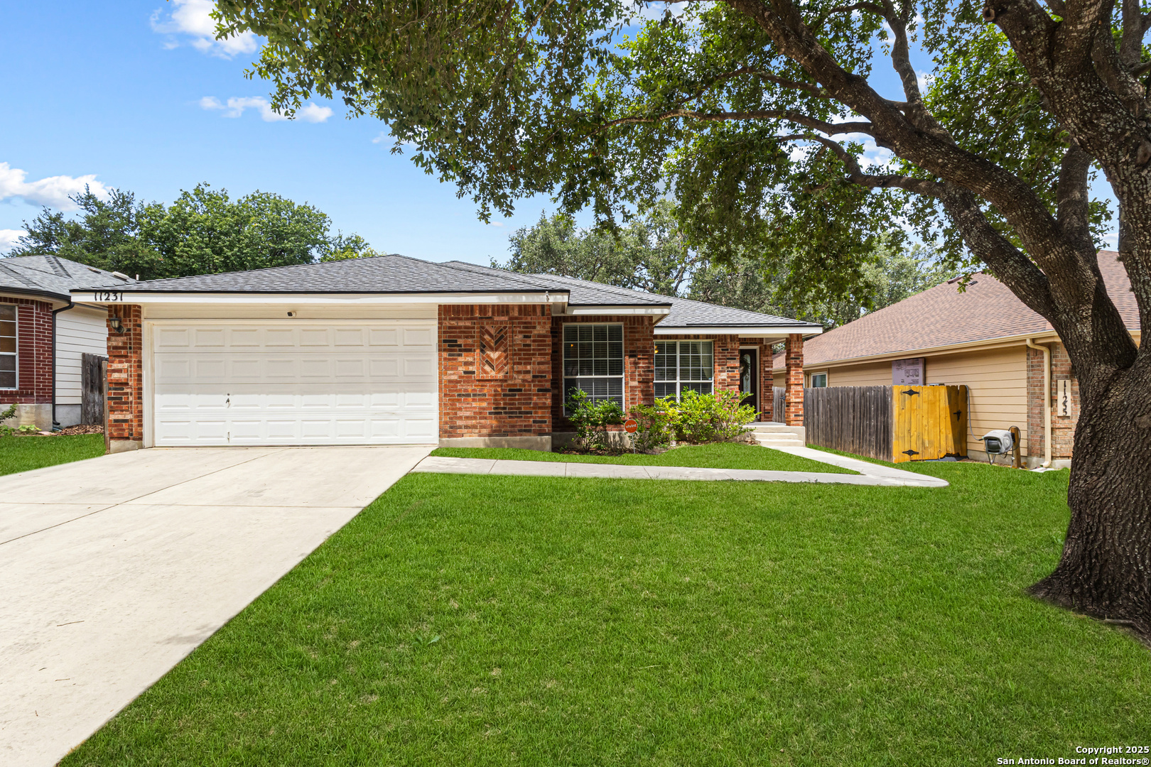 a front view of house with yard and green space