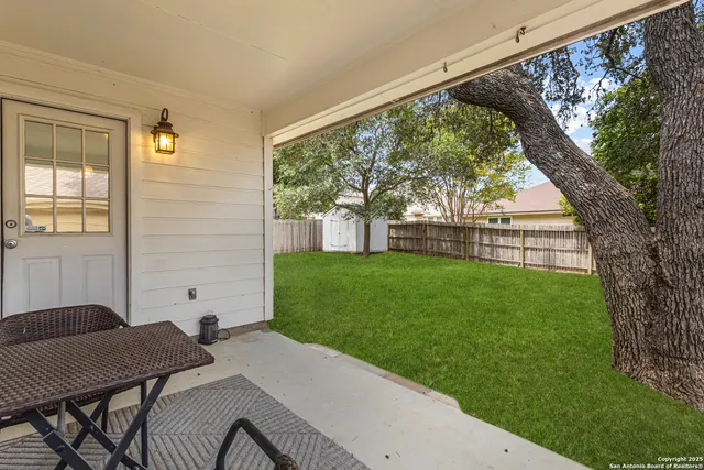 a view of backyard with a garden and seating