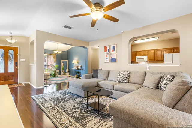 a living room with furniture and a rug