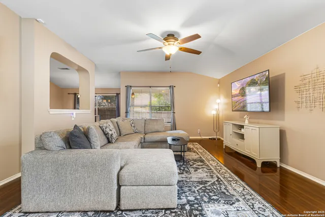 a living room with furniture and a window