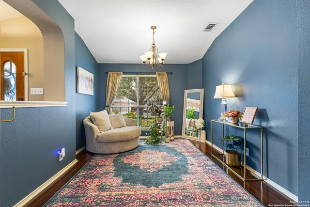 a living room with furniture and a window