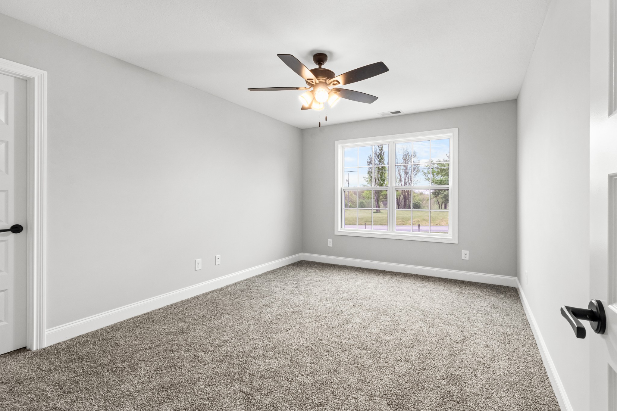 2177 Lock B Road North Clarksville, TN 37043 - Photo 23 of 41 an empty room with windows and fan