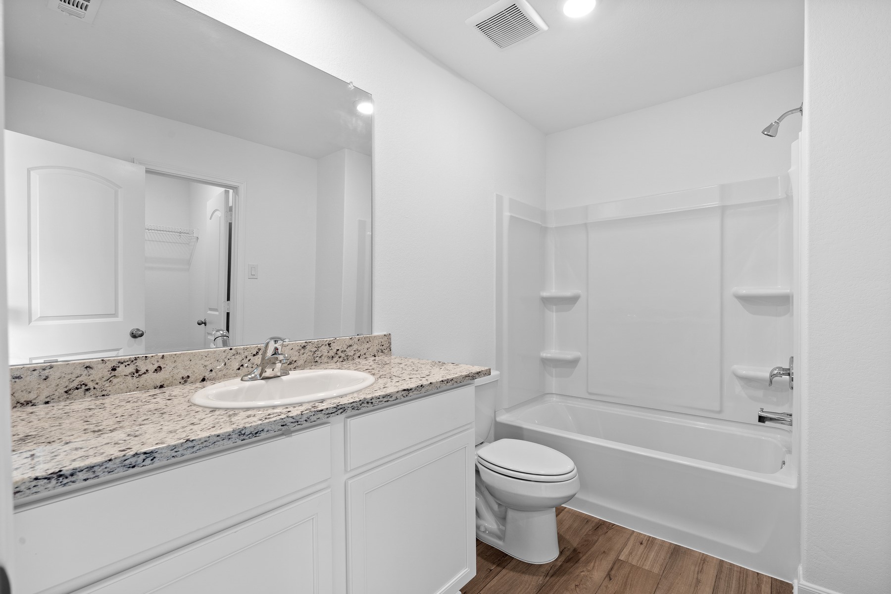 368 Low Pasture Trail Maxwell, TX 78656 - Photo 13 of 13 a bathroom with a granite countertop sink toilet and shower