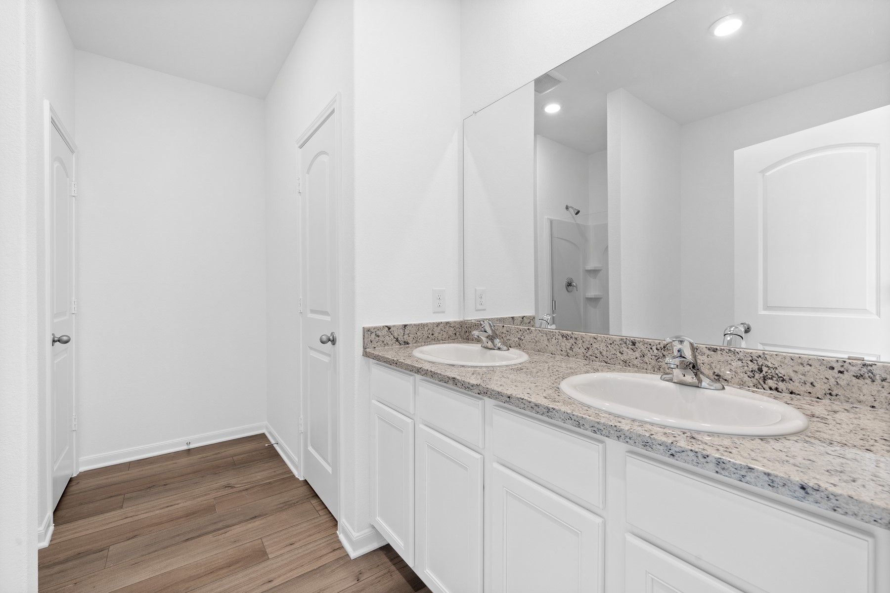 368 Low Pasture Trail Maxwell, TX 78656 - Photo 6 of 13 a bathroom with a granite countertop sink and a mirror