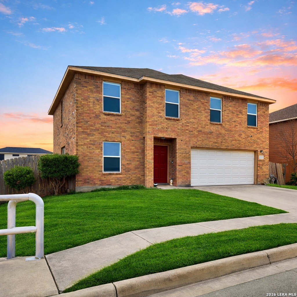 9818 Copper Elm Converse, TX 78109 - Photo 2 of 11 a brick house with a yard