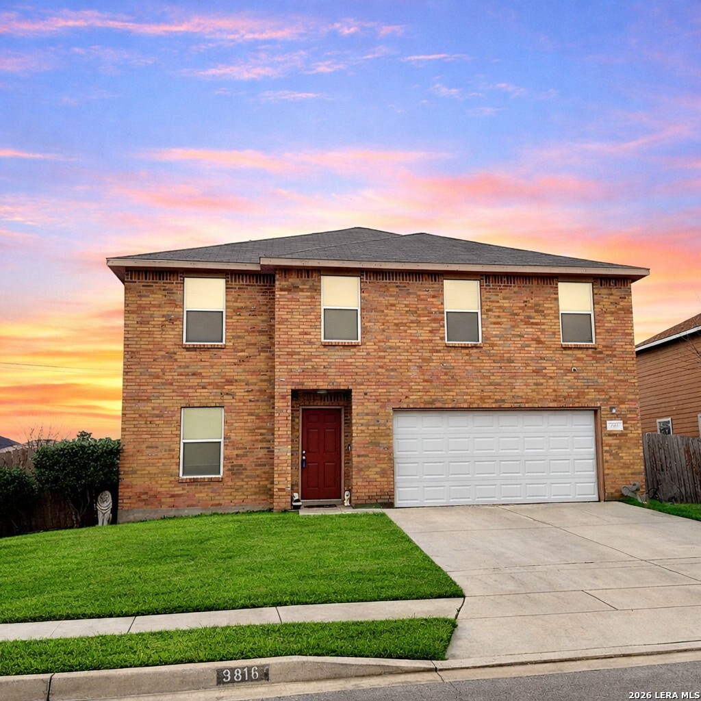 9818 Copper Elm Converse, TX 78109 - Photo 3 of 11 a front view of a house with a garden