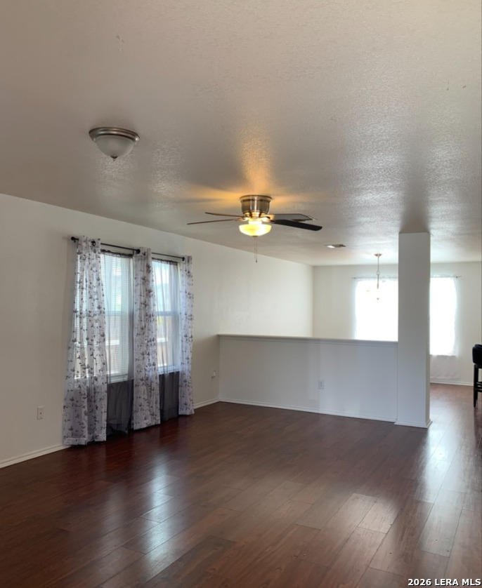 9818 Copper Elm Converse, TX 78109 - Photo 4 of 11 an empty room with wooden floor and windows