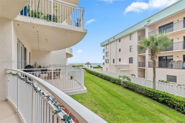 a balcony with view of car parked