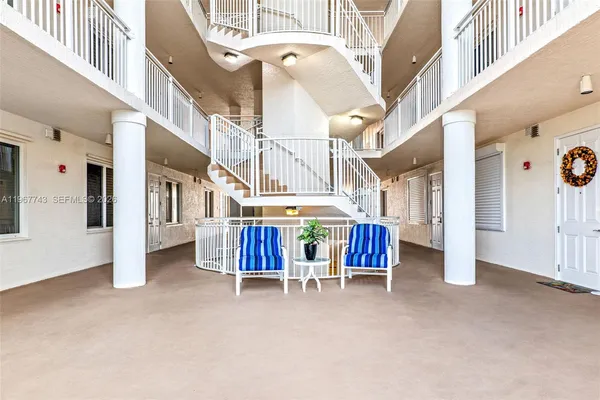 a view of an chairs and table of the building