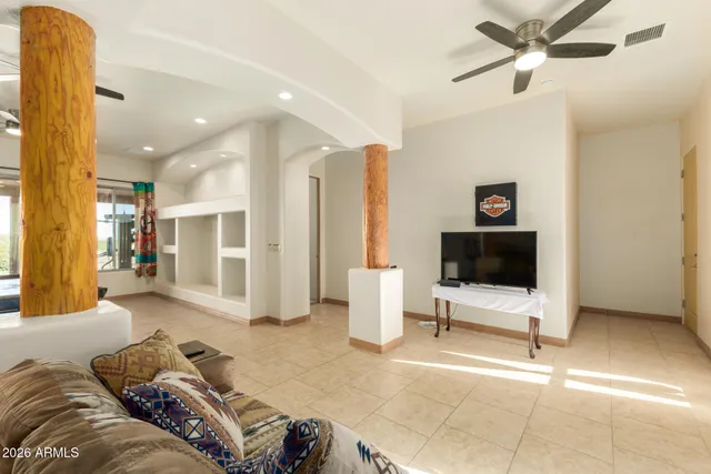 a kitchen with a sink a stove and white cabinets