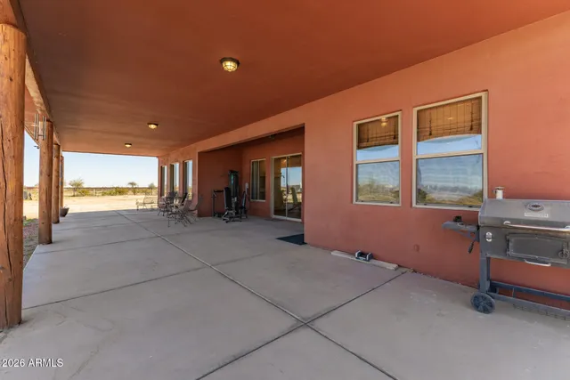 a view of a road with a road sign on the background