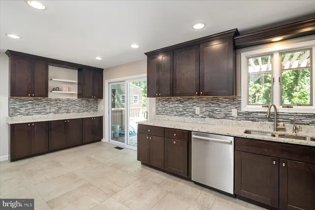 a large kitchen with a large window and counter