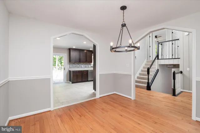 a view of a room with wooden floor and fireplace