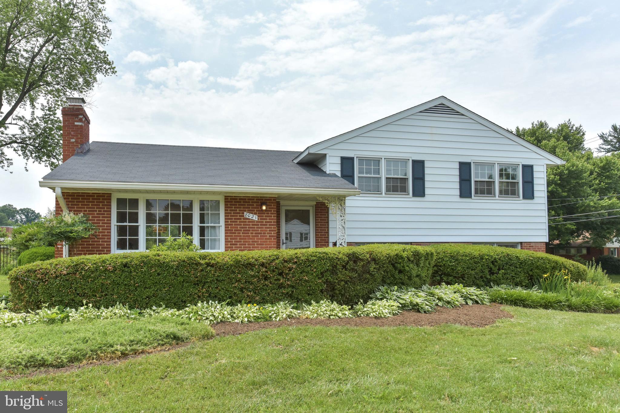 8021 Ellet Road Springfield, VA 22151 - Photo 1 of 53 a front view of a house with a yard
