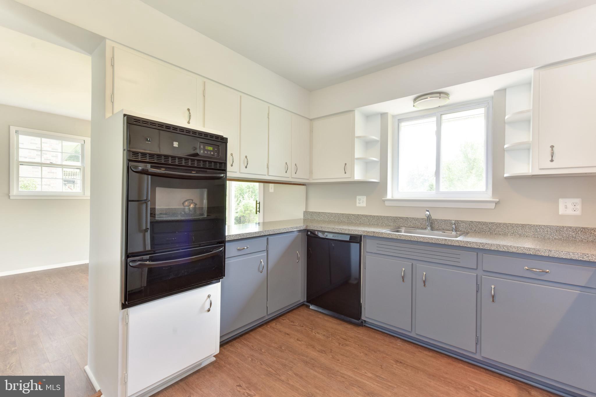 8021 Ellet Road Springfield, VA 22151 - Photo 12 of 53 a kitchen with granite countertop cabinets stainless steel appliances and a sink