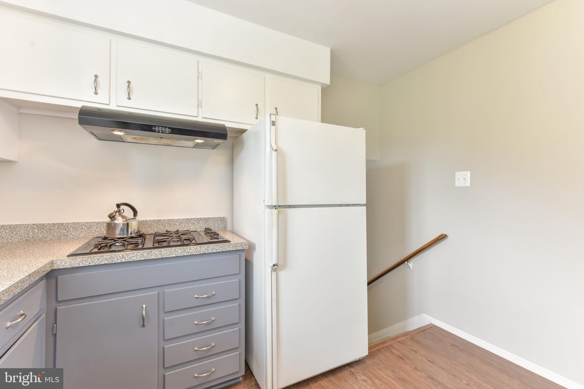 8021 Ellet Road Springfield, VA 22151 - Photo 15 of 53 a kitchen with appliances cabinets and a counter top space