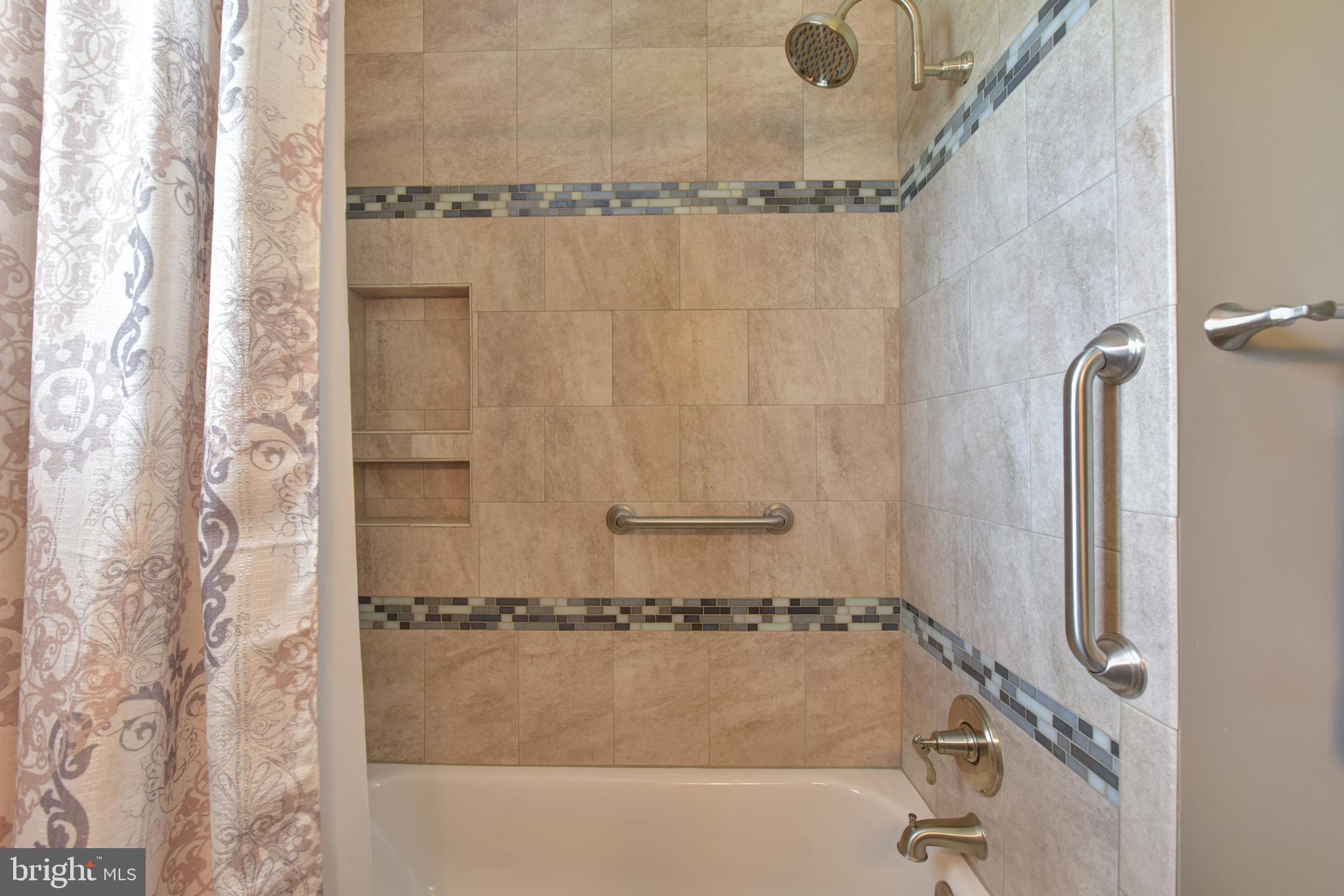 8021 Ellet Road Springfield, VA 22151 - Photo 16 of 53 a bathroom with a shower