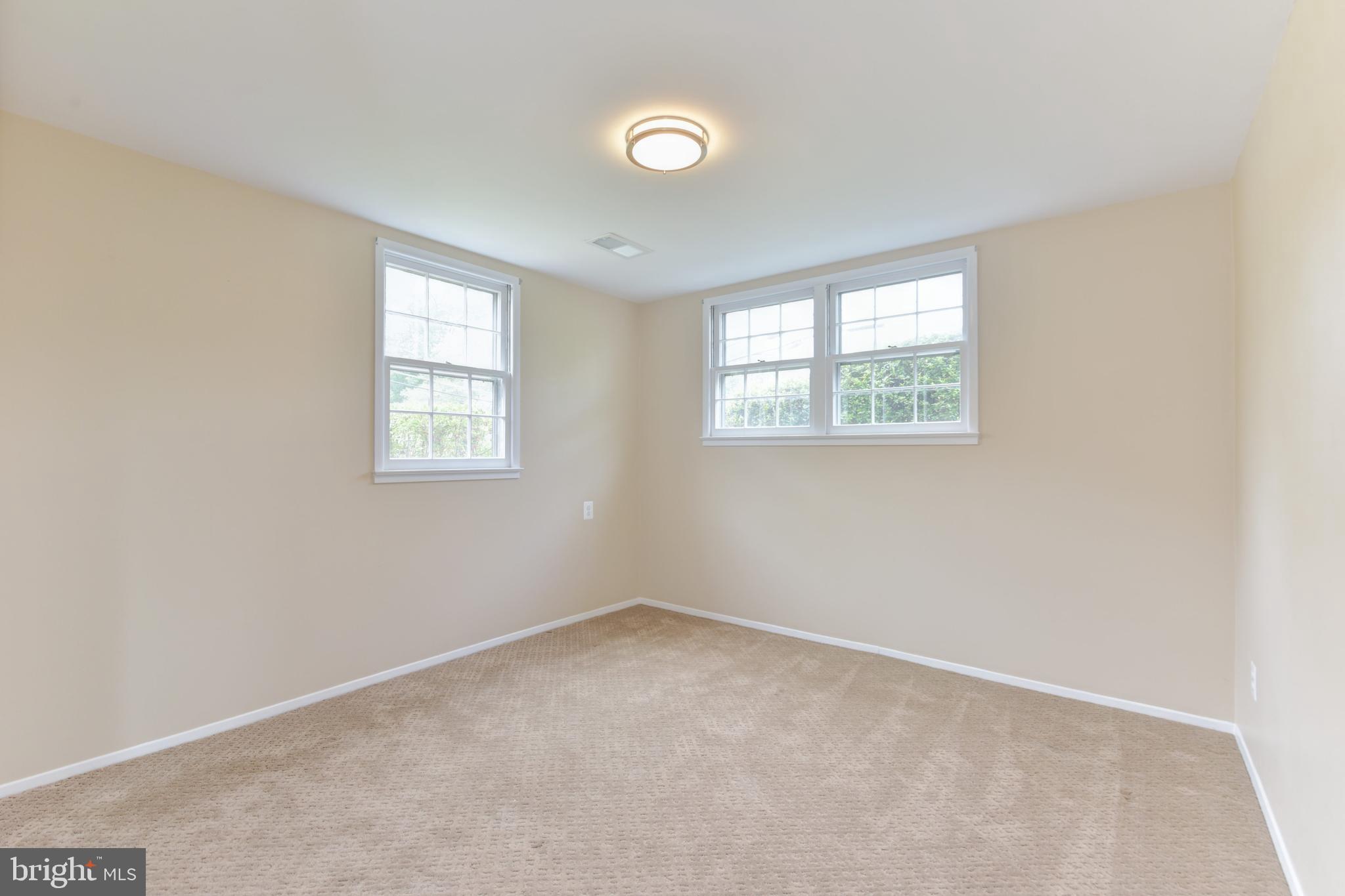 8021 Ellet Road Springfield, VA 22151 - Photo 28 of 53 an empty room with windows and closet