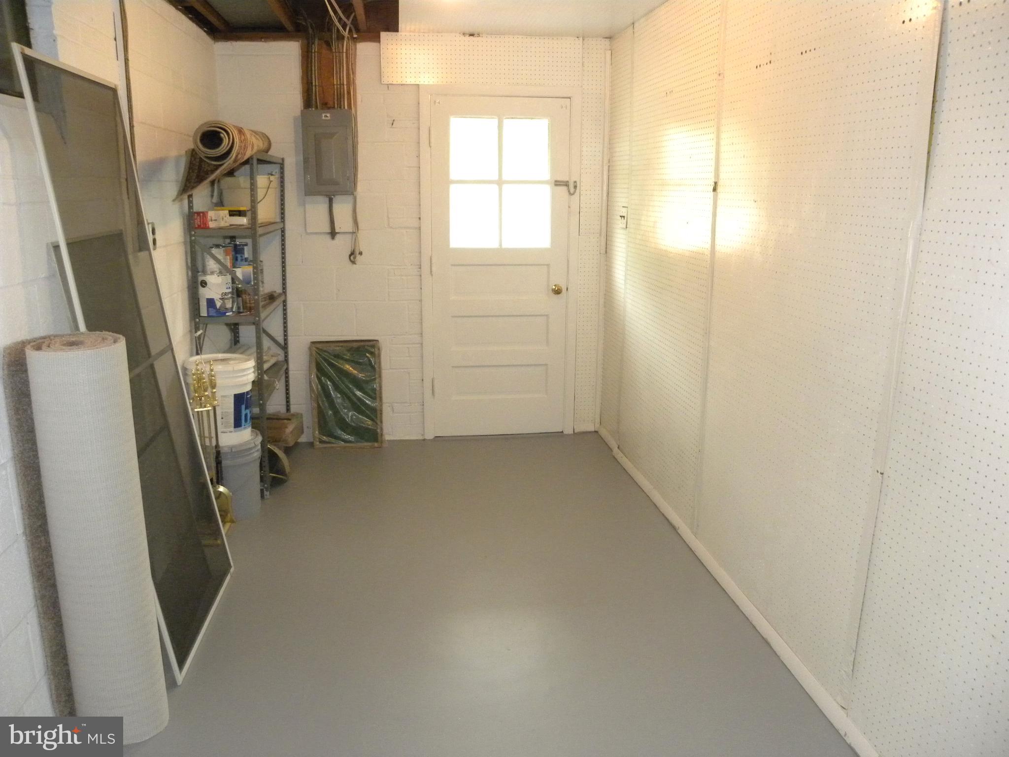 8021 Ellet Road Springfield, VA 22151 - Photo 30 of 53 a view of a hallway with a refrigerator and a window