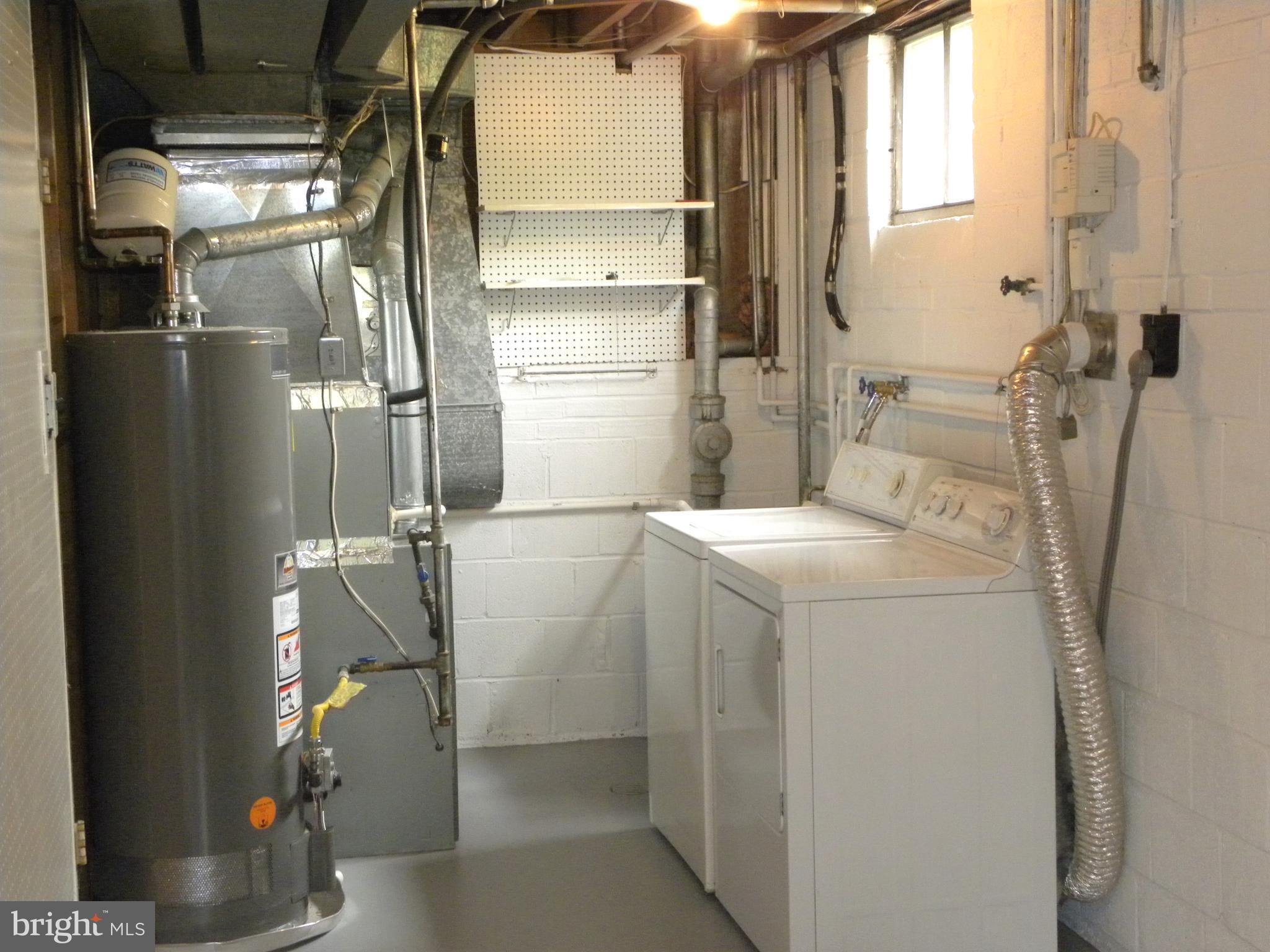8021 Ellet Road Springfield, VA 22151 - Photo 32 of 53 a utility room with dryer and washer