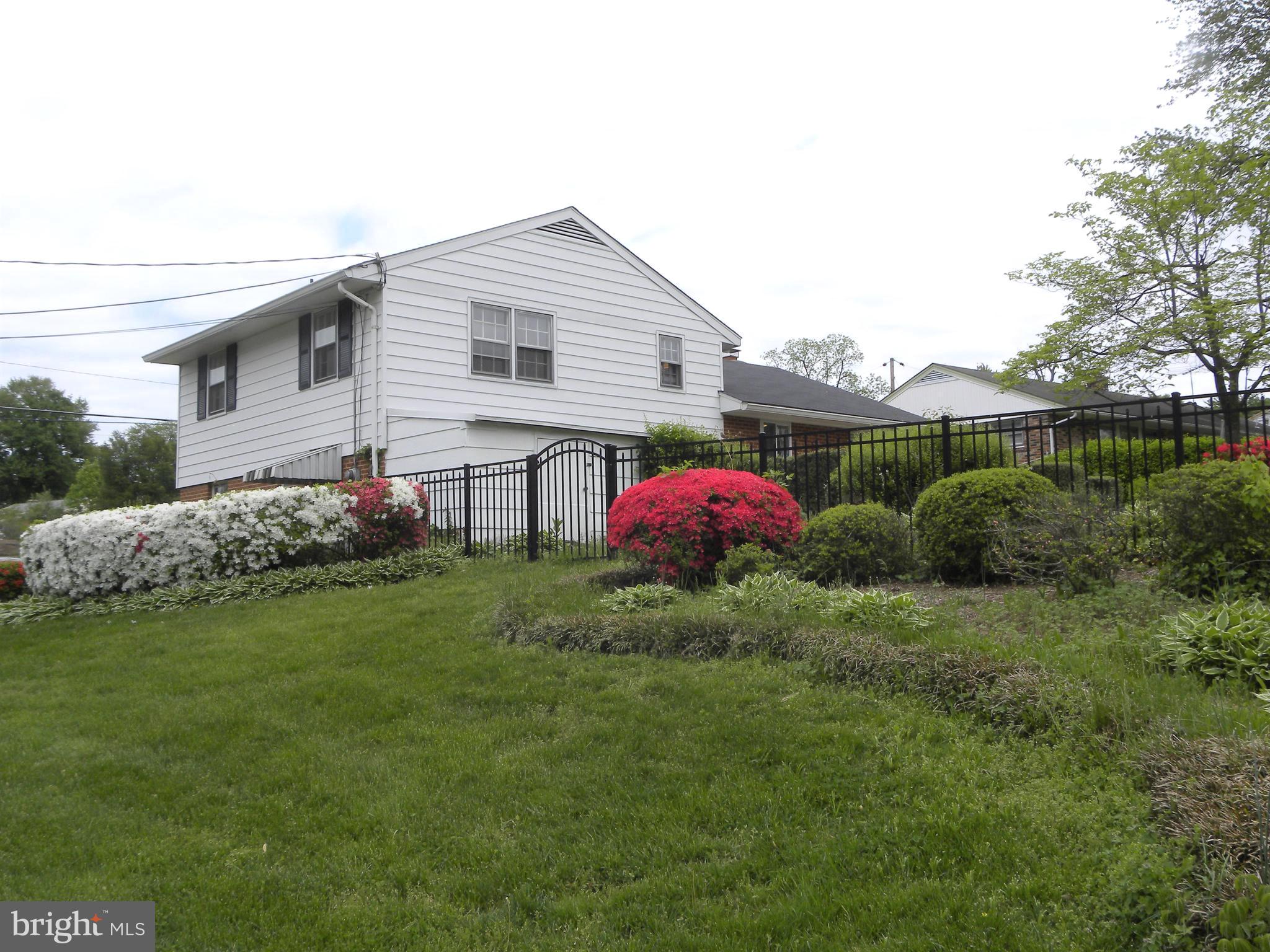 8021 Ellet Road Springfield, VA 22151 - Photo 47 of 53 a view of a backyard with plants and a garden