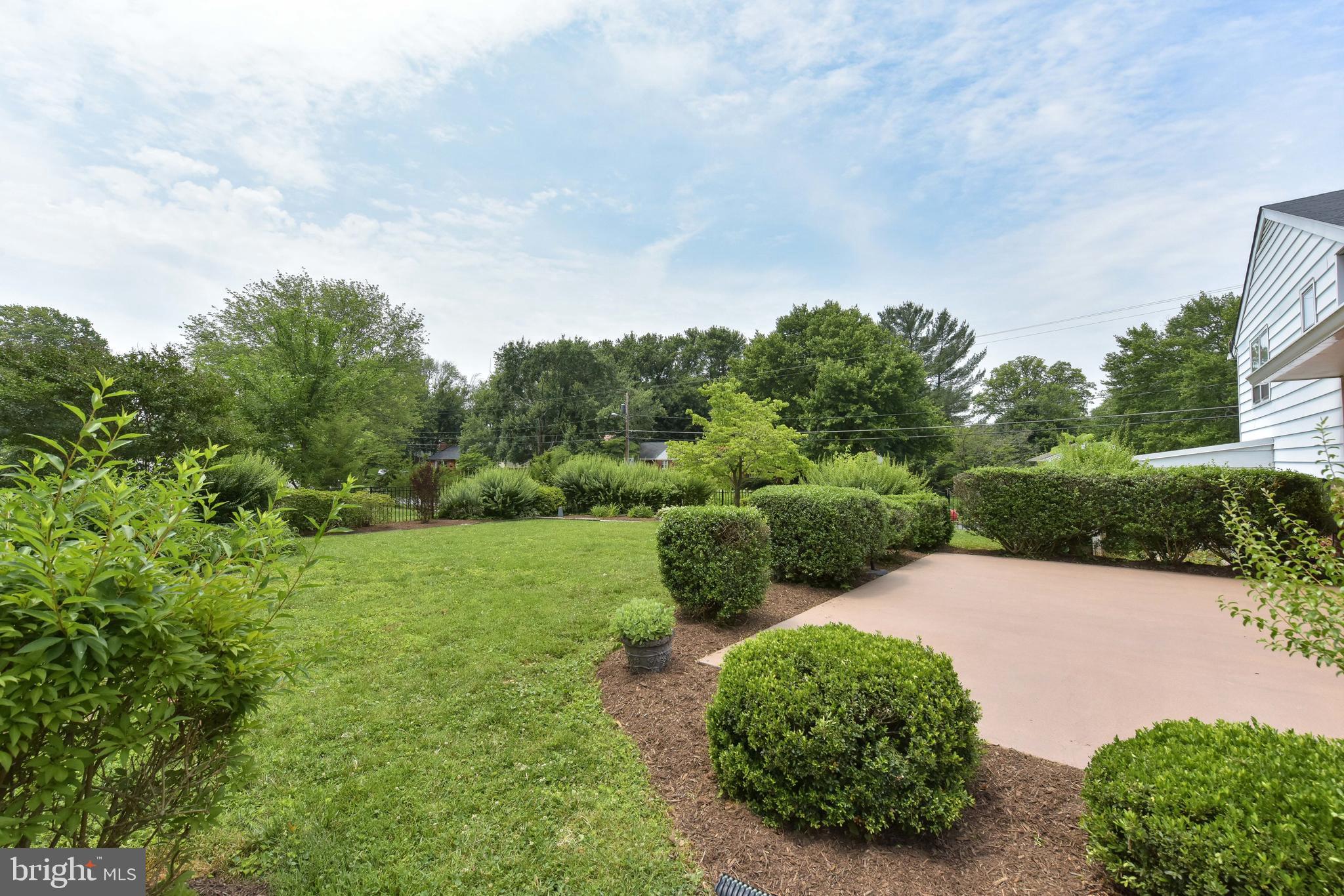 8021 Ellet Road Springfield, VA 22151 - Photo 49 of 53 a view of a garden with a building in the background
