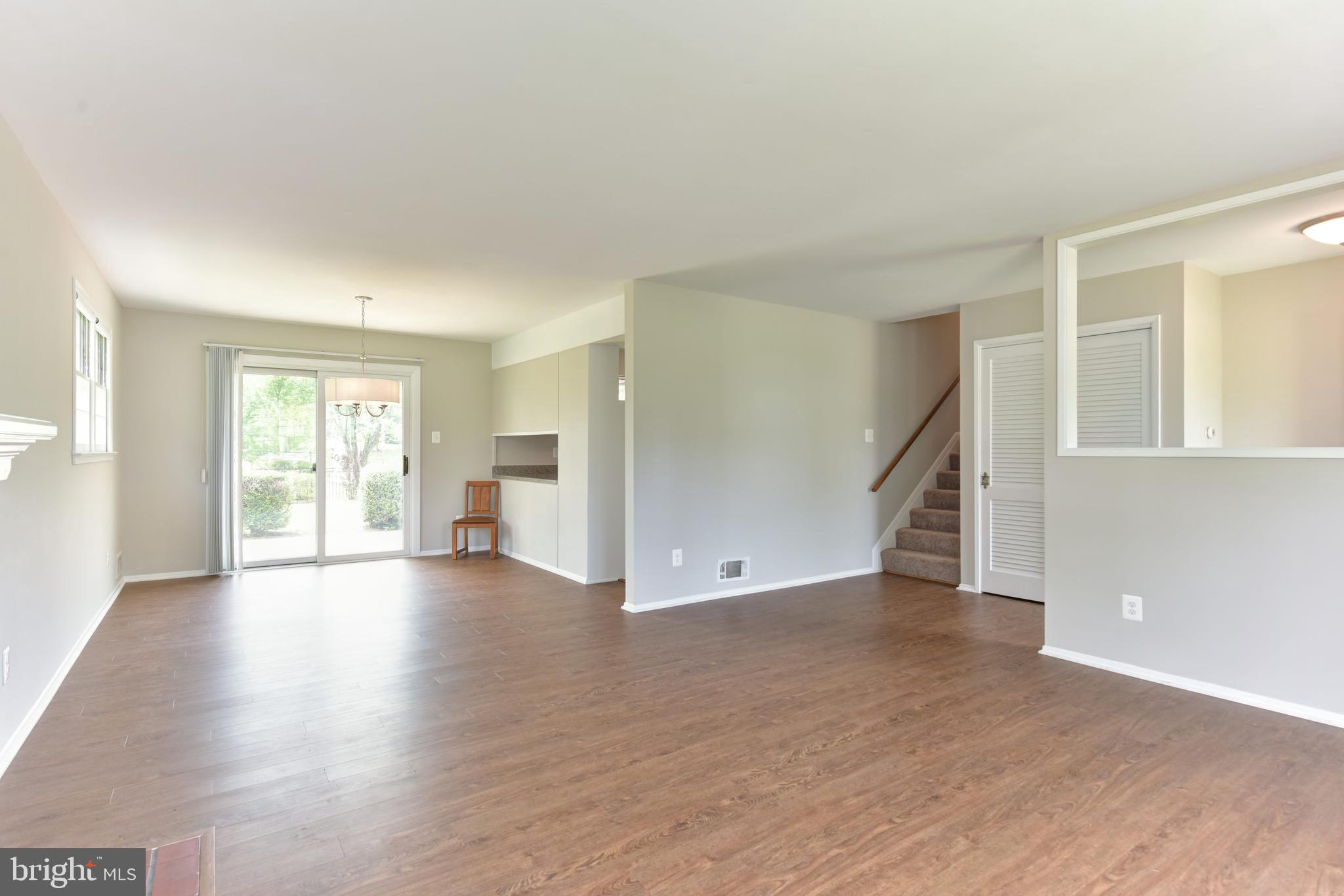 8021 Ellet Road Springfield, VA 22151 - Photo 6 of 53 a view of an empty room with wooden floor and a window